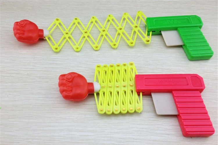 đồ chơi quả đấm lò xo hình súng cho bé